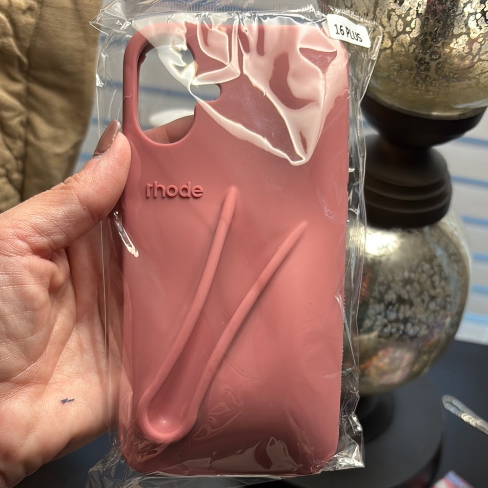 RHODE Blush Pink iPhone 16 plus case with matching lipgloss.